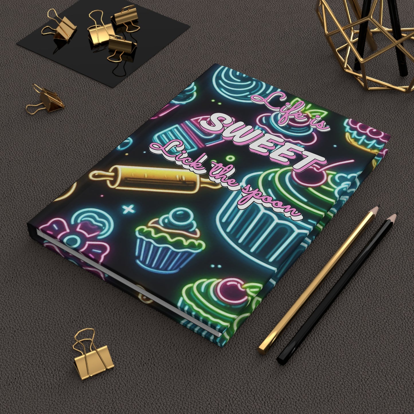 Neon hardcover journal titled "Life is Sweet, Lick the Spoon" with colorful design, ideal for note-taking or journaling.