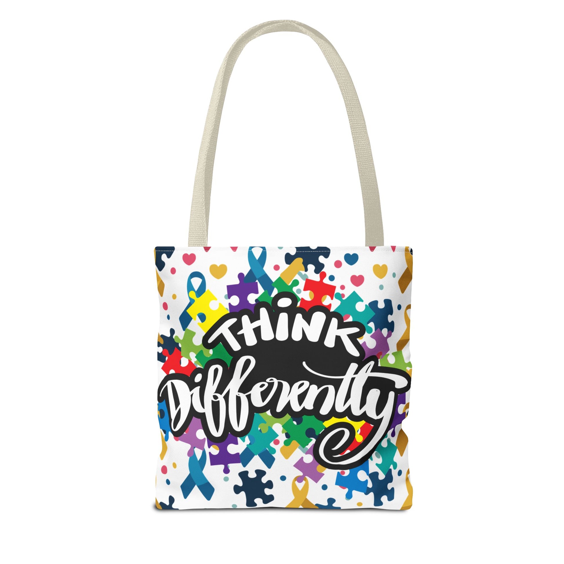 Colorful puzzle ribbon design on a Think Differently Autism Awareness tote bag by Printify, showcasing vibrant colors and patterns.