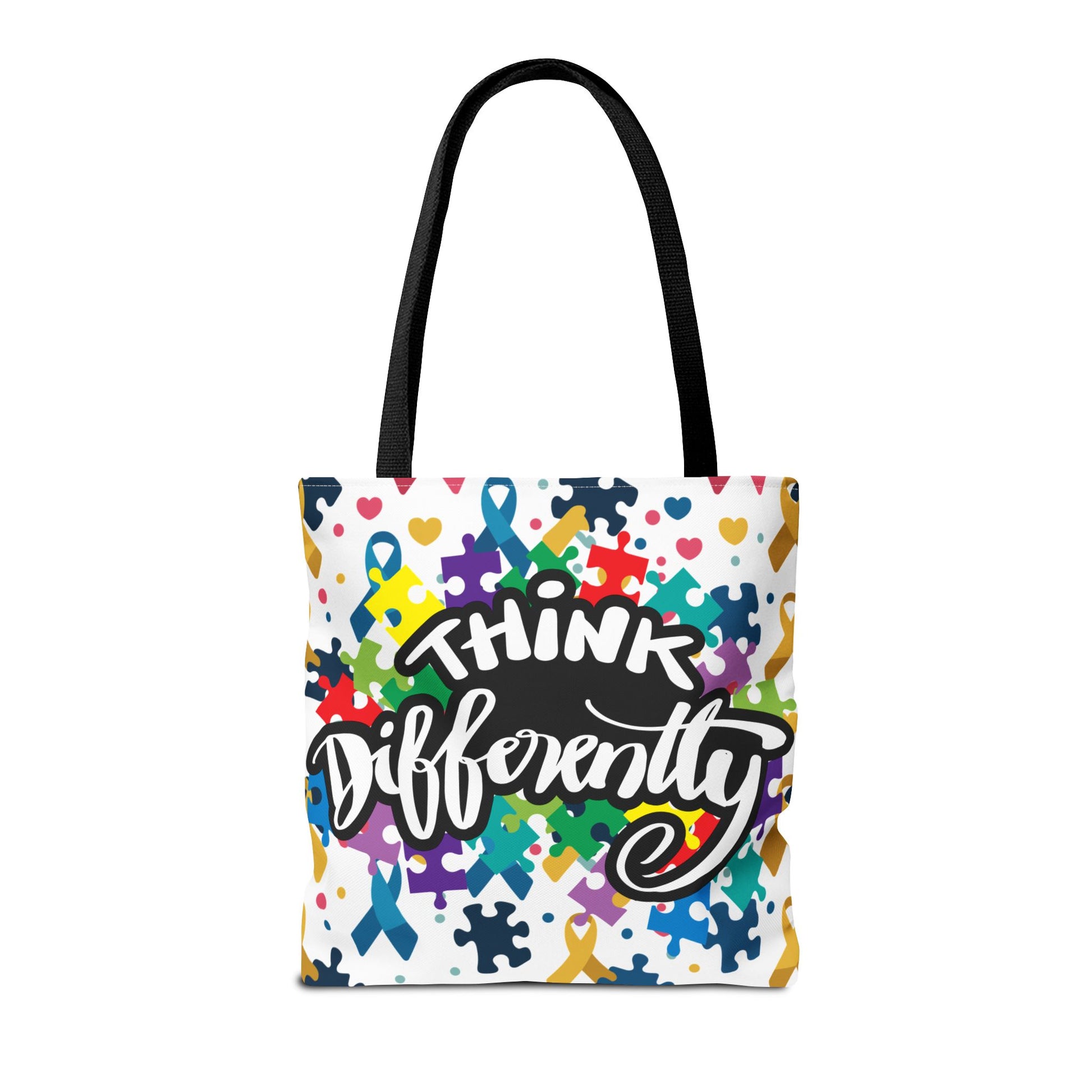 Colorful puzzle ribbon design on Think Differently Autism Awareness tote bag by Printify, showcasing vibrant patterns.