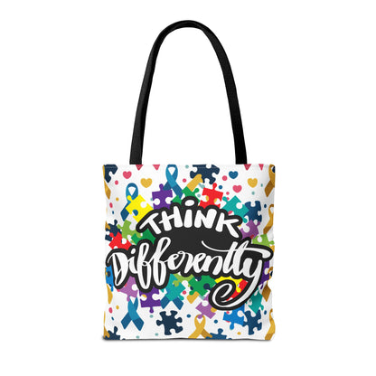 Colorful puzzle ribbon design on Think Differently Autism Awareness tote bag by Printify, showcasing vibrant patterns.