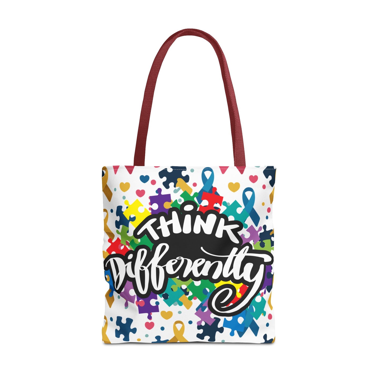 Colorful puzzle ribbon design on Think Differently Autism Awareness tote bag by Printify, perfect for everyday use.
