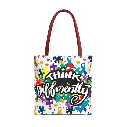 Colorful puzzle ribbon design on Think Differently Autism Awareness tote bag by Printify, perfect for everyday use.