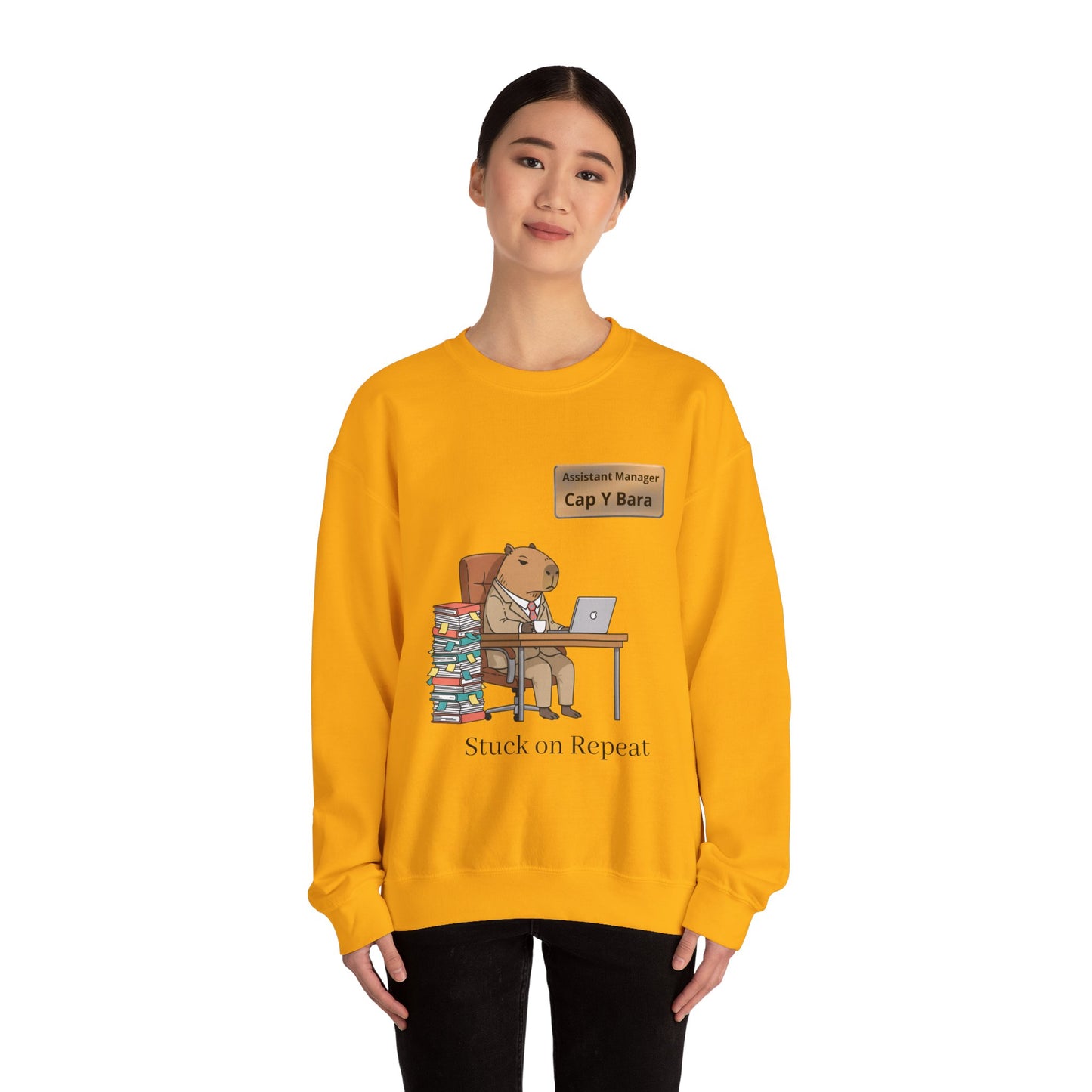 Gray sweatshirt featuring an illustration of an office capybara at a desk, representing unhinged animal bureaucracy, by Printify.