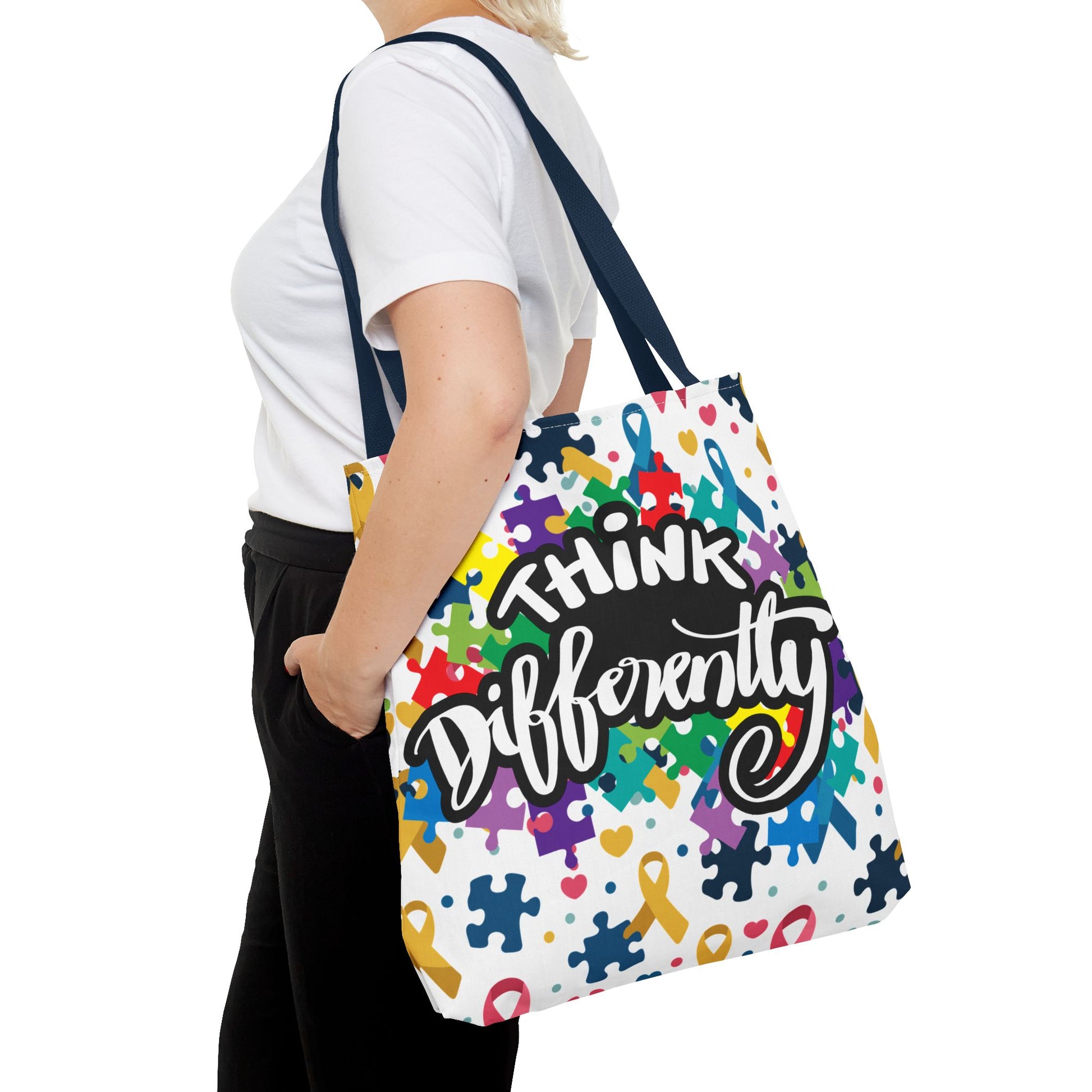 Colorful Think Differently Autism Awareness tote bag featuring a puzzle ribbon design by Printify.