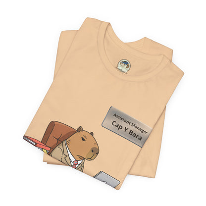 Capybara in suit desk tee featuring "Stuck on Repeat" personalized nameplate graphic, casual cotton T-shirt by Printify.