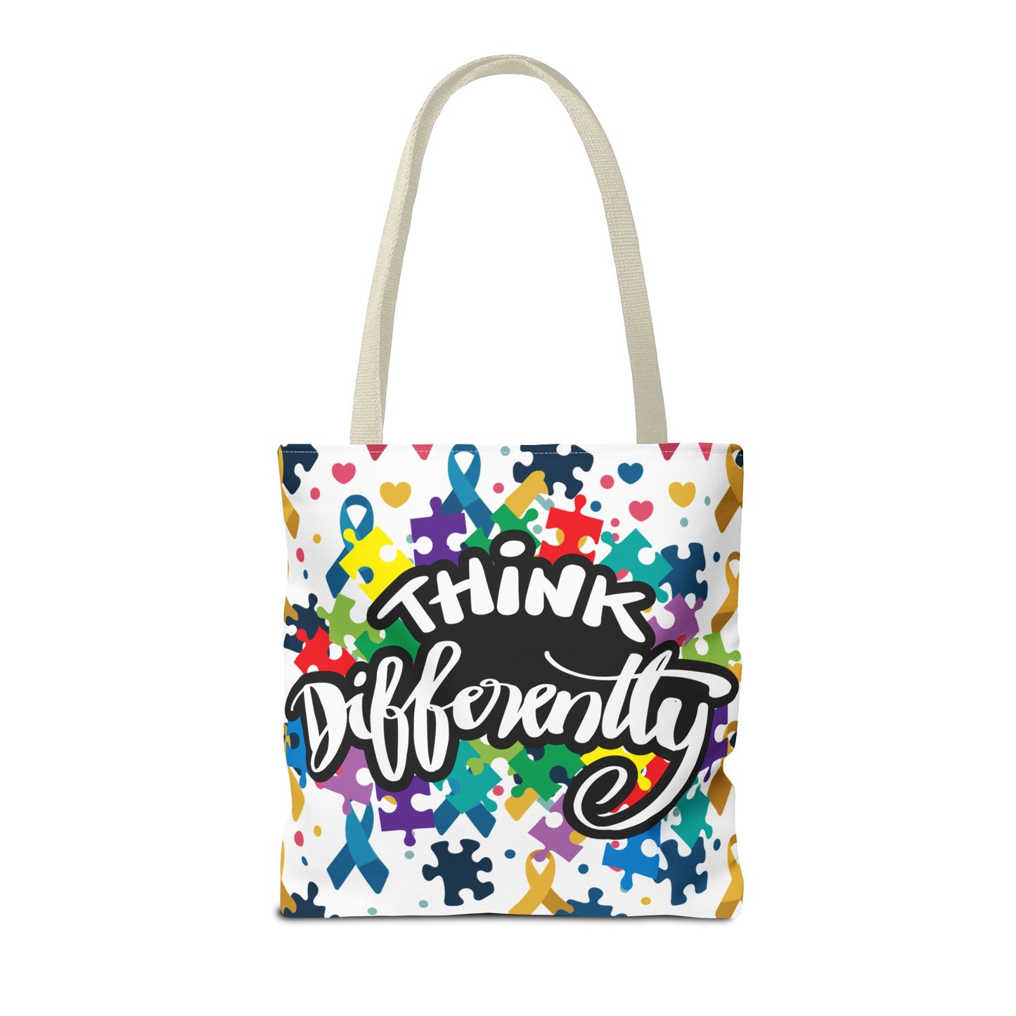 Colorful puzzle ribbon design on Think Differently Autism Awareness tote bag by Printify, showcasing vibrant patterns.