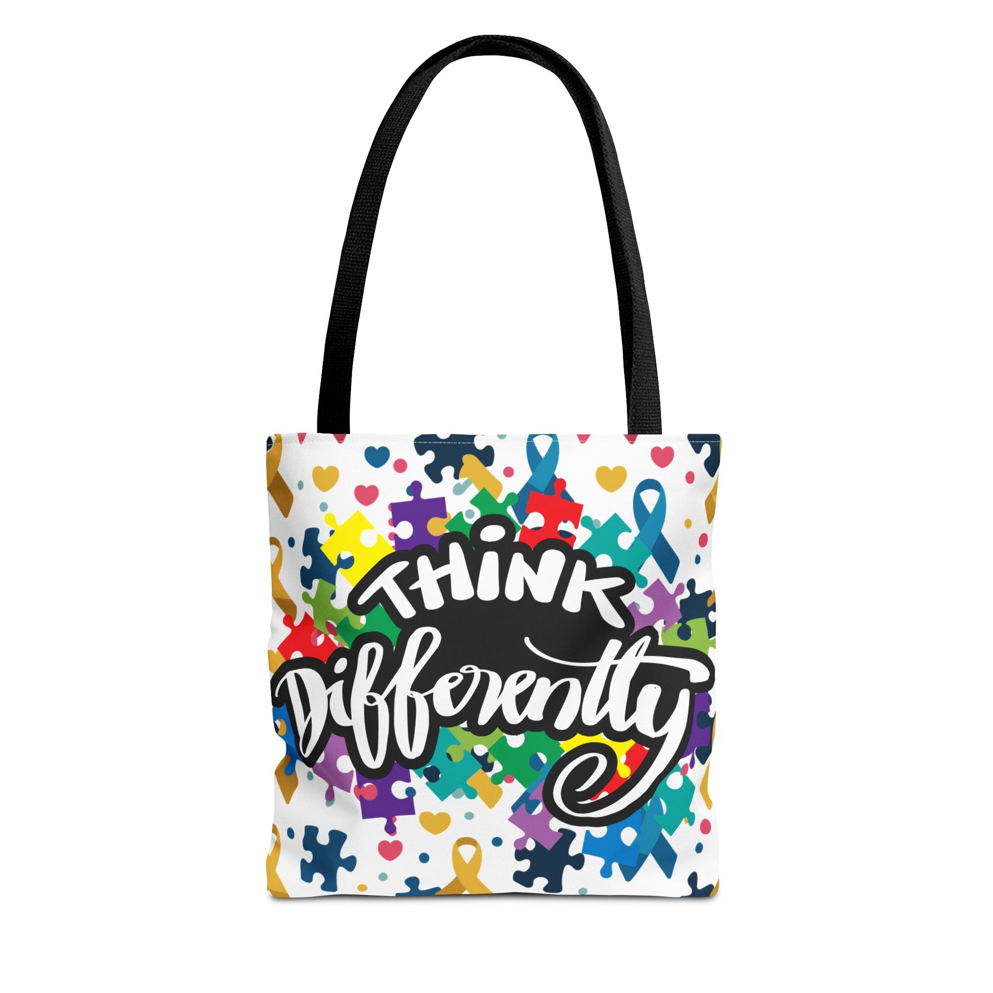Colorful puzzle ribbon design on Think Differently Autism Awareness tote bag by Printify, showcasing vibrant artwork.