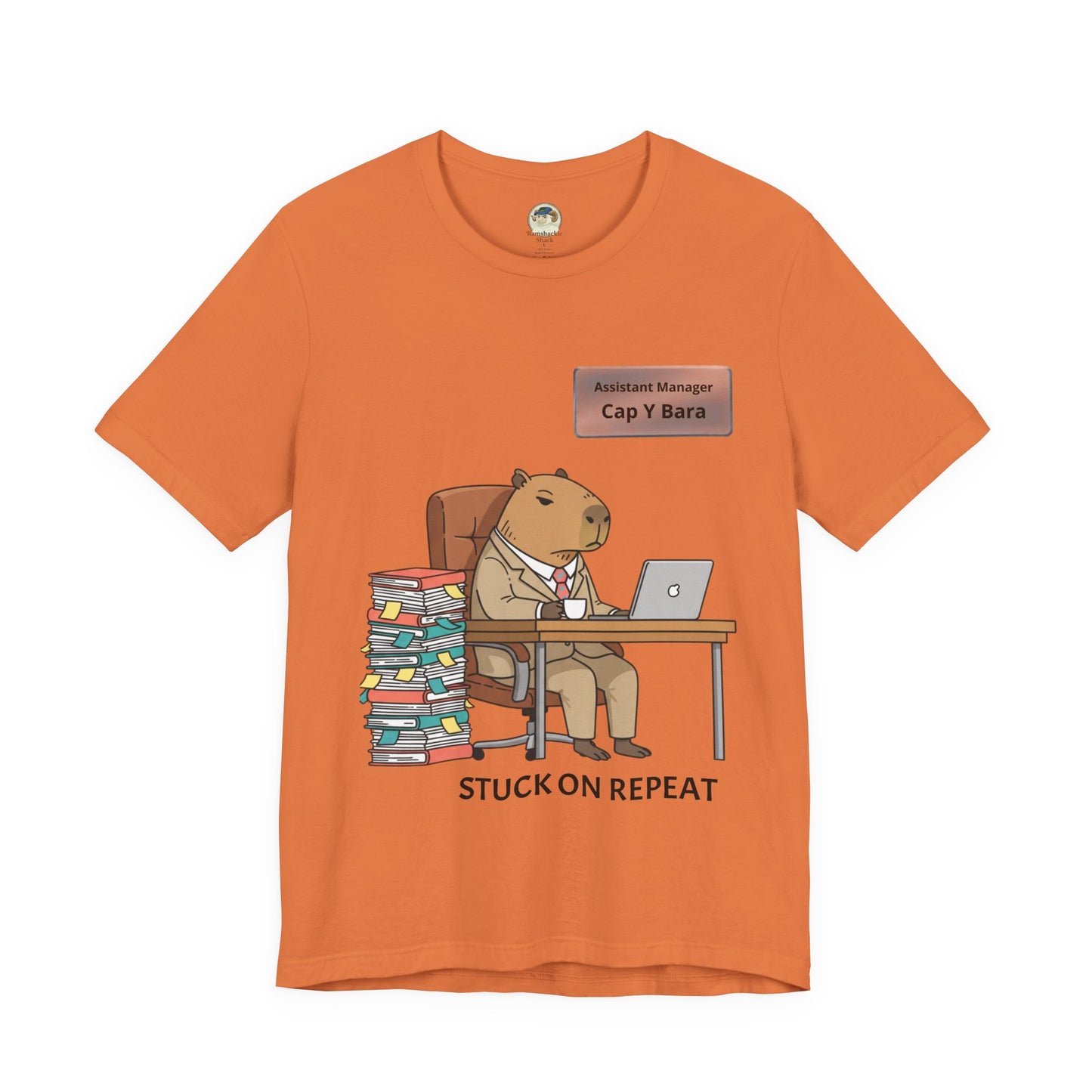 Printify T-Shirt featuring a capybara in a suit with "Stuck on Repeat" text and personalized nameplate design on a casual tee.