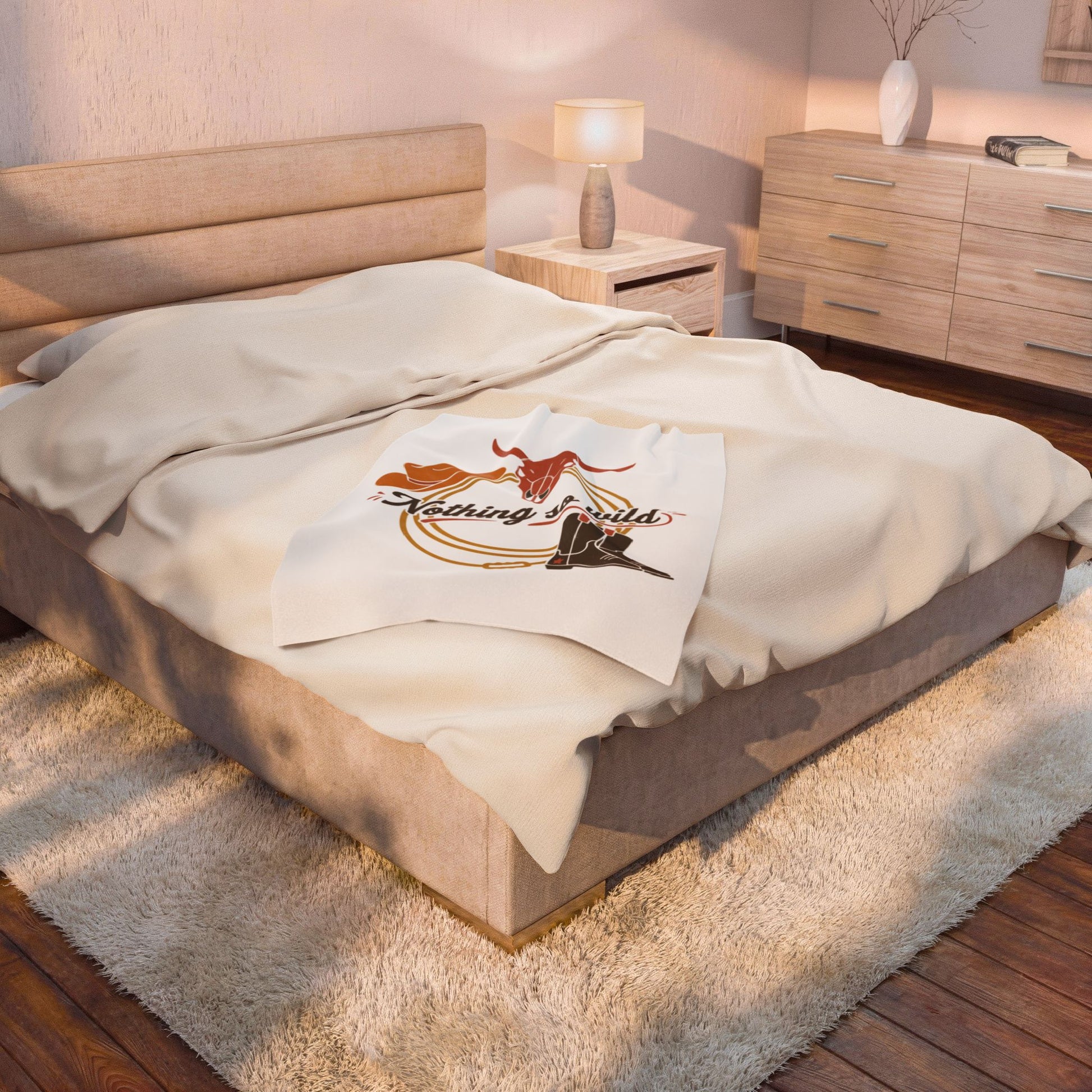 Velveteen plush blanket with cowboy chic all-over western desert print, soft and cozy for western-themed decor.
