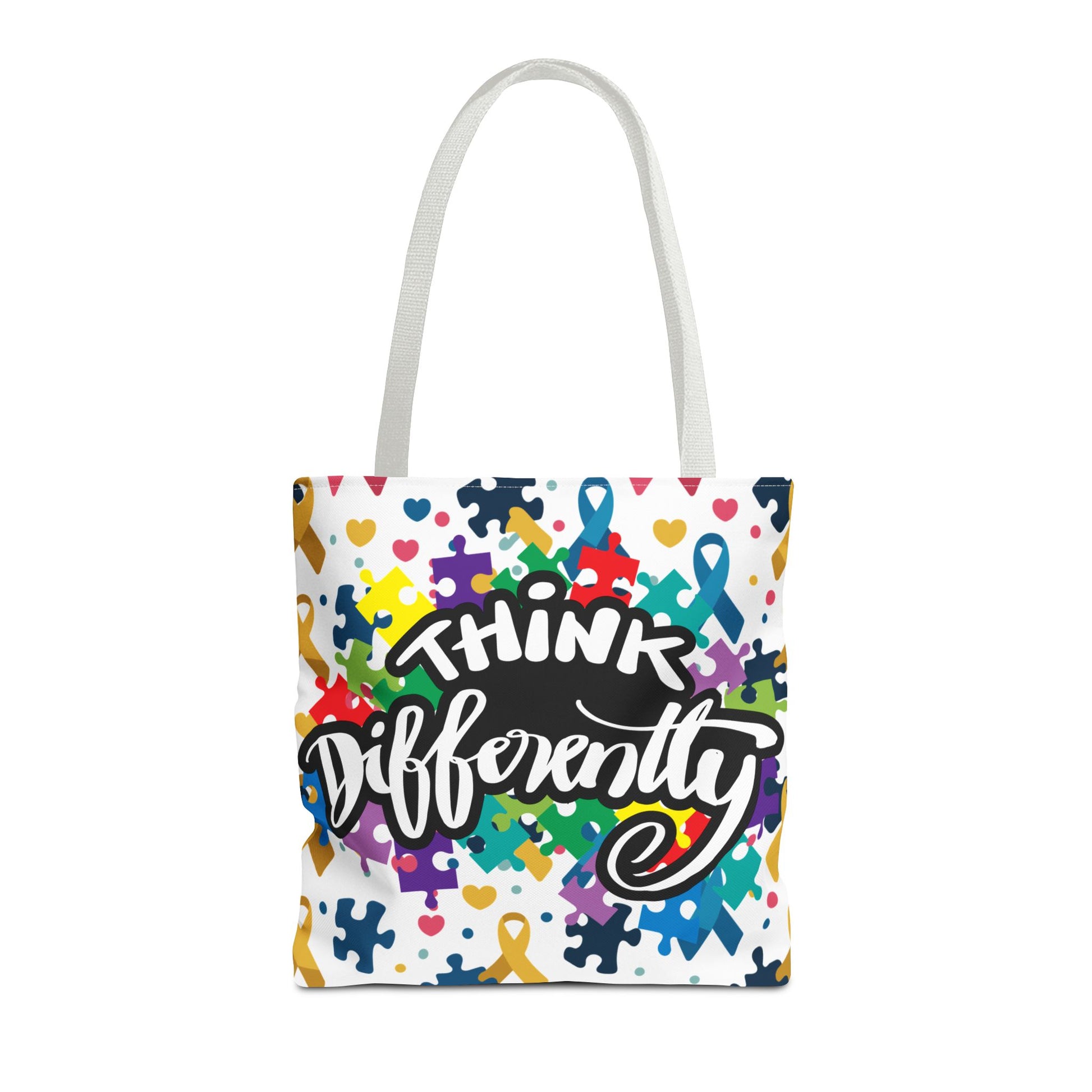Colorful puzzle ribbon design on Think Differently Autism Awareness tote bag by Printify. Reusable and stylish accessory.