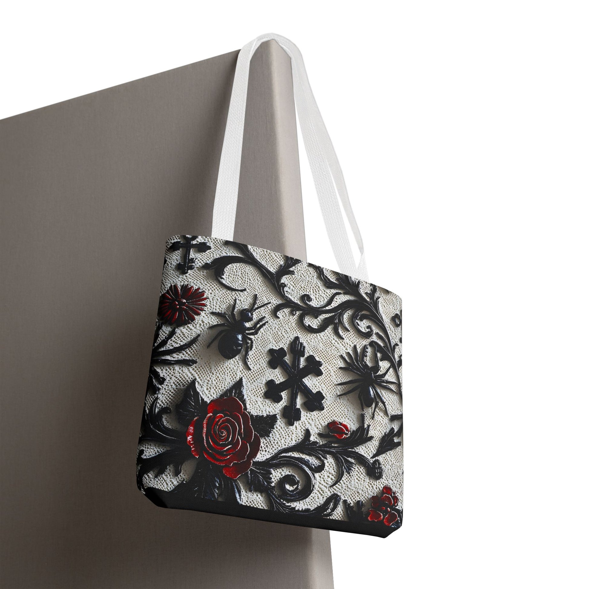 Gothic filigree tote bag with ornate dark floral all-over print, showcasing intricate floral design on a black fabric background.
