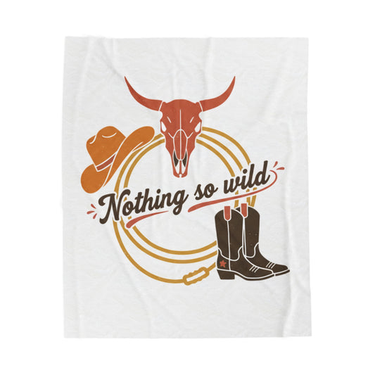 Velveteen plush blanket with western desert print by Nothing So Wild, featuring cowboy chic all-over pattern in muted tones.