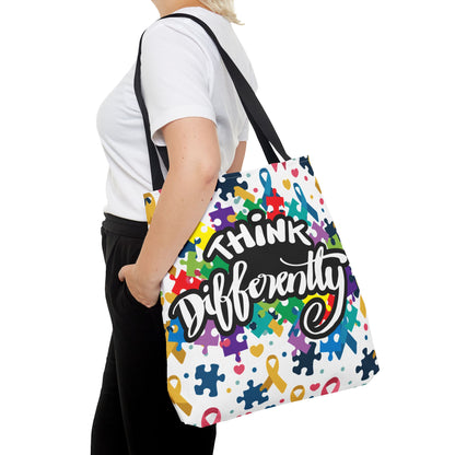 Colorful puzzle ribbon design on Think Differently Autism Awareness tote bag by Printify, showcasing vibrant colors and patterns.