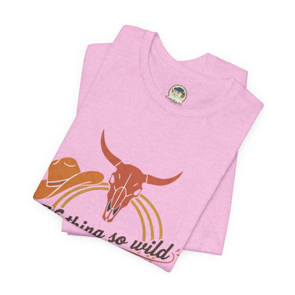 Personalized Western sunset T-shirt featuring the Nothing So Wild Rider design, made by Printify, with vibrant sunset and cowboy motif.