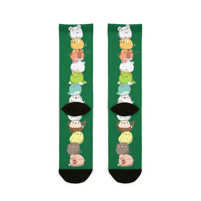 Green crew socks with colorful stacked cartoon animal print, featuring cute kawaii animal designs for all-over sublimation.