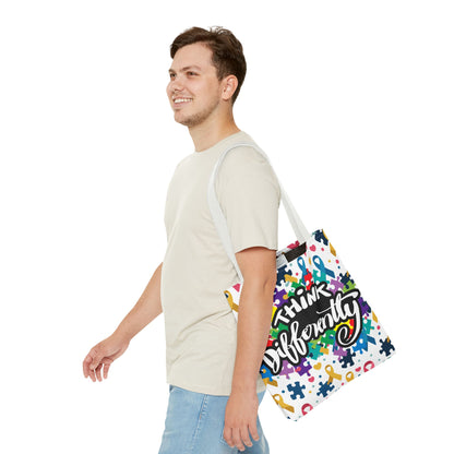 Colorful puzzle ribbon design on Think Differently Autism Awareness tote bag by Printify, showcasing vibrant patterns.