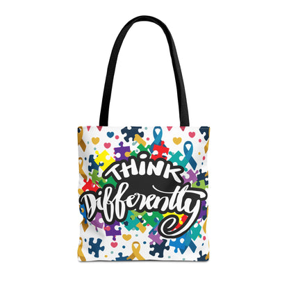 Colorful puzzle ribbon design on a Think Differently Autism Awareness tote bag by Printify.