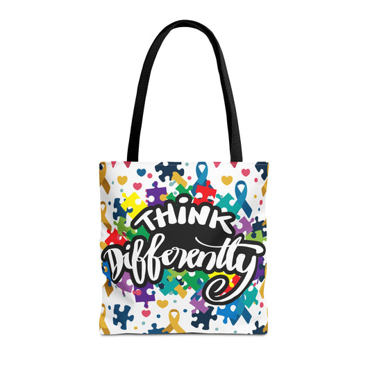 Colorful puzzle ribbon design on a Think Differently Autism Awareness tote bag by Printify.