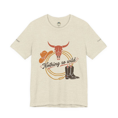 Personalized western sunset T-shirt from Nothing So Wild Rider Tee by Printify, featuring a rugged desert sunset design.