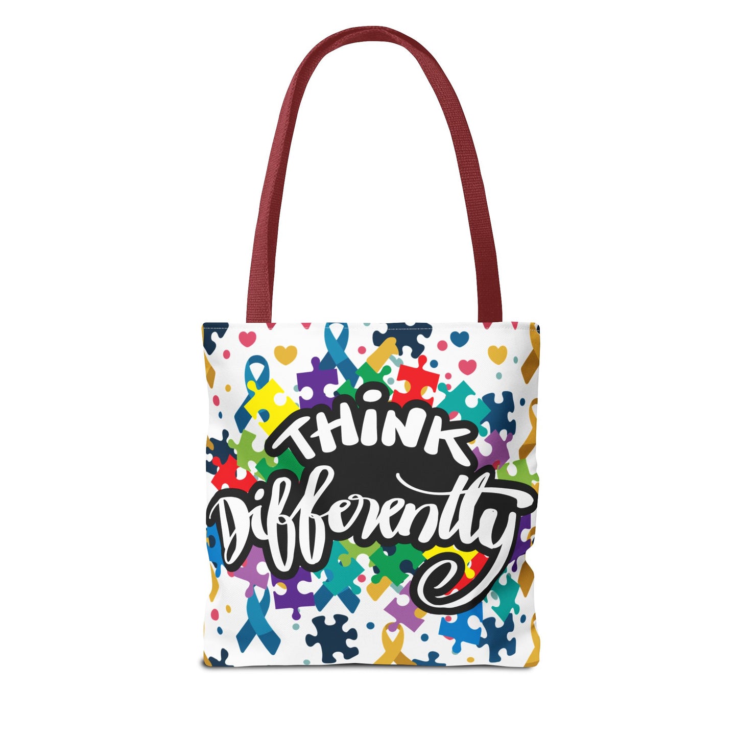 Colorful puzzle ribbon design on Think Differently Autism Awareness tote bag by Printify, showcasing vibrant patterns.
