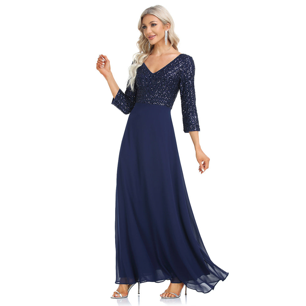 Women's sequined evening dress with chiffon V-neck by Ramshackle Shack, featuring sparkling embellishments and flowing fabric.