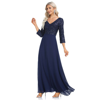 Women's sequined evening dress with chiffon V-neck by Ramshackle Shack, featuring sparkling embellishments and flowing fabric.