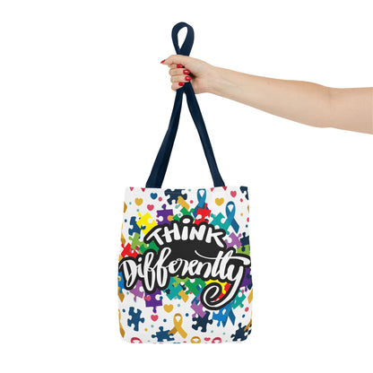 Colorful puzzle ribbon design on Think Differently Autism Awareness tote bag by Printify, showcasing vibrant patterns.