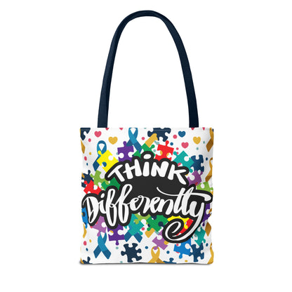 Colorful puzzle ribbon design on Think Differently Autism Awareness tote bag by Printify, showcasing vibrant patterns.