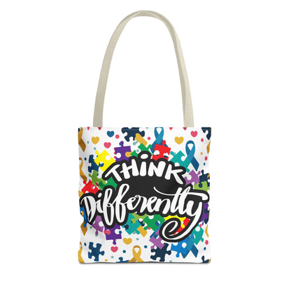 Colorful puzzle ribbon design on Think Differently Autism Awareness tote bag by Printify, showcasing vibrant patterns.