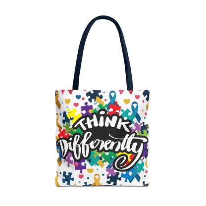 Colorful puzzle ribbon design on Think Differently Autism Awareness tote bag by Printify, showcasing vibrant patterns.