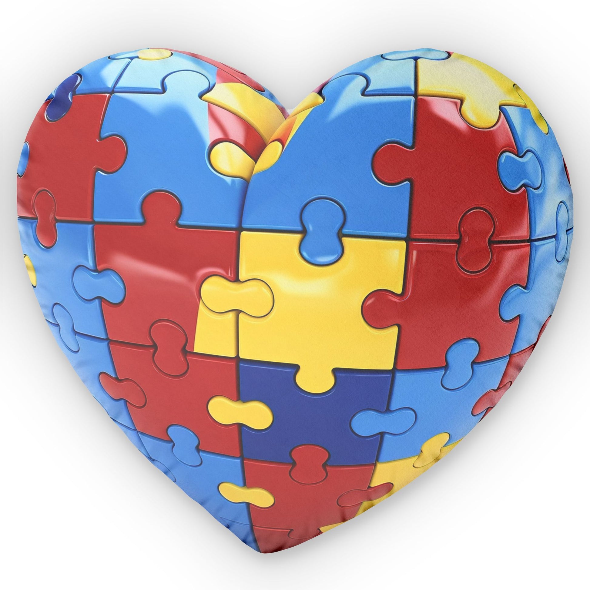 Autism puzzle heart pillow by Printify, featuring a colorful puzzle design on a soft, plush fabric.