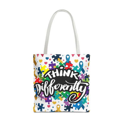 Colorful autism awareness tote bag featuring a puzzle ribbon design by Printify, showcasing vibrant colors and spacious interior.