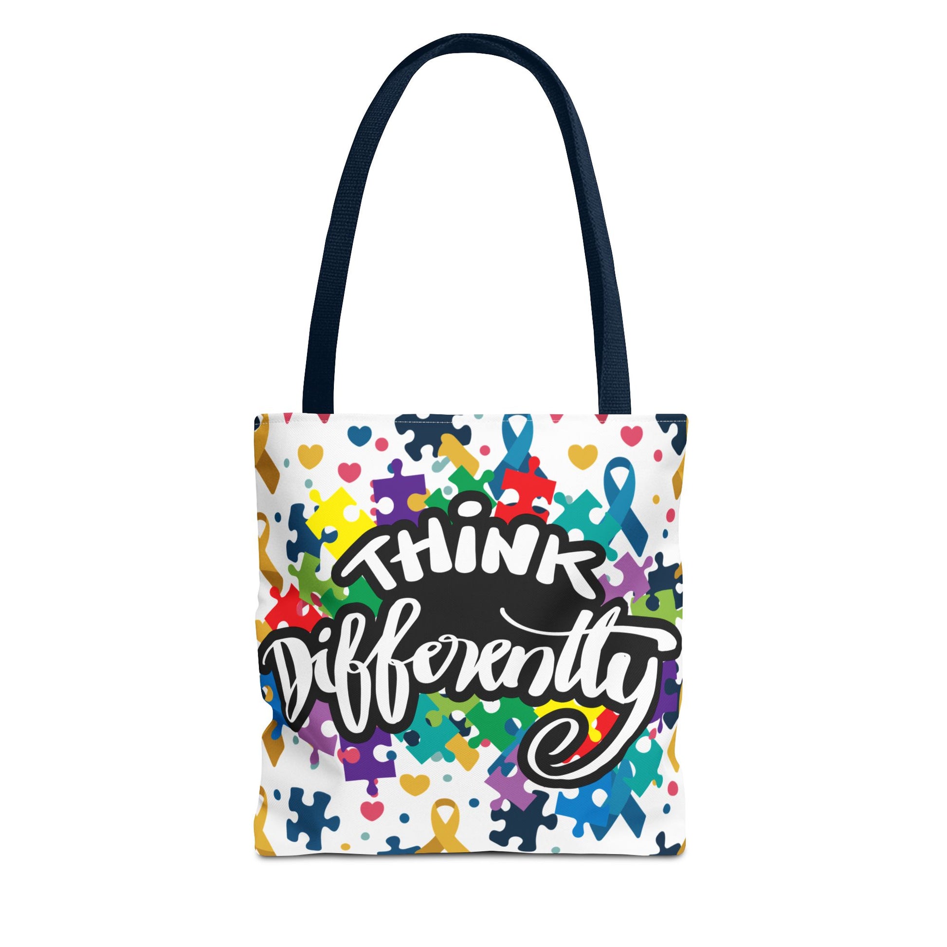Colorful puzzle ribbon design on Think Differently Autism Awareness tote bag by Printify, showcasing vibrant patterns.