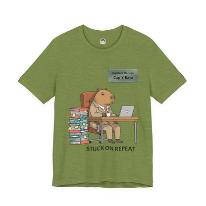 Gray T-shirt featuring a cartoon capybara in a suit and the "Stuck on Repeat" phrase, personalized with a nameplate design.