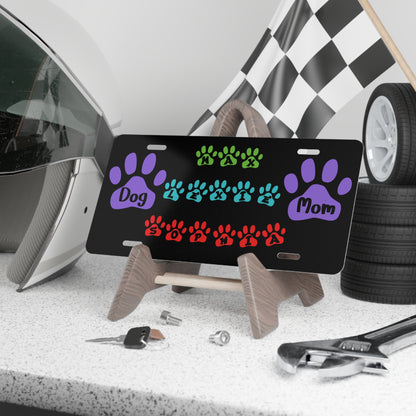 Colorful personalized dog mom paw print vanity license plate with pet design, perfect for dog lovers and vehicle decor.