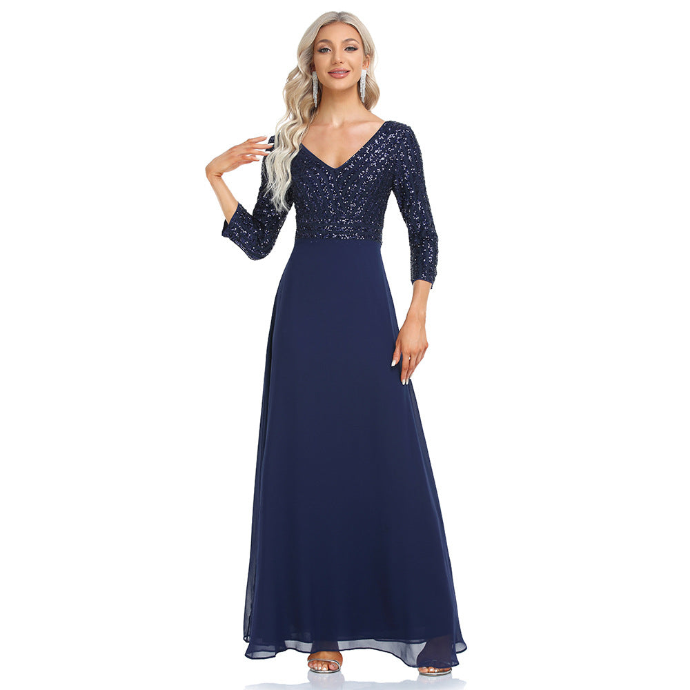 Women's sequined evening dress with chiffon V-neck by Ramshackle Shack, featuring elegant shimmer and flowing fabric.