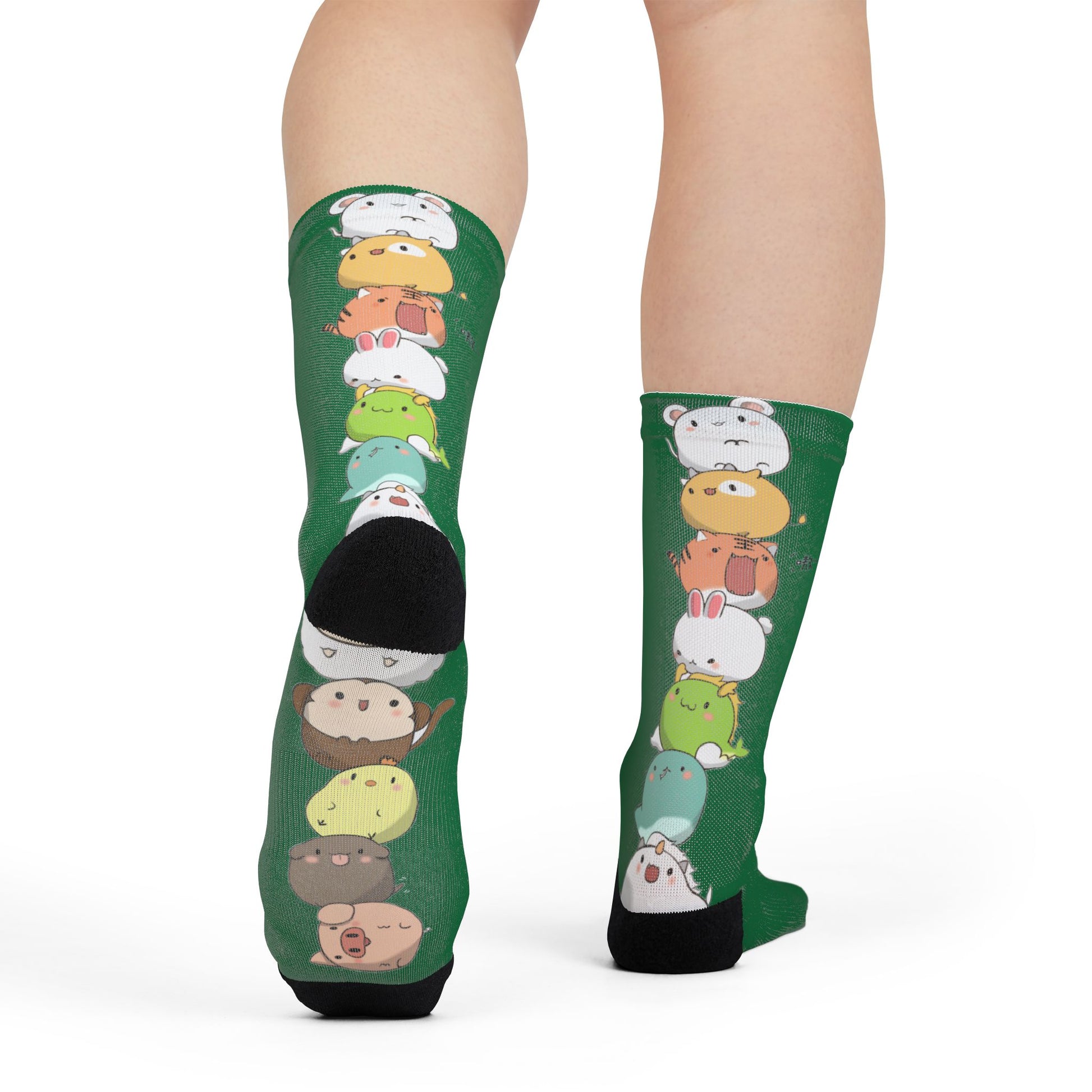 Green crew socks featuring colorful stacked cartoon animal prints with cute kawaii designs, all over print by Printify.