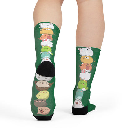 Green crew socks featuring colorful stacked cartoon animal prints with cute kawaii designs, all over print by Printify.