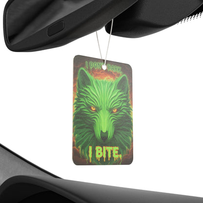 Neon wolf-shaped car air freshener with "I Don't Bark I Bite" text, hanging from a vehicle's rearview mirror.
