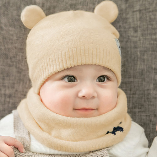 Ramshackle Shack hat and scarf set featuring a cozy knitted hat and matching scarf in warm, earthy tones.