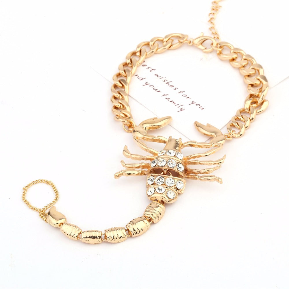 Faux diamond-studded scorpion anklet with silver chain and intricate details, stylish jewelry accessory for ankle adornment.