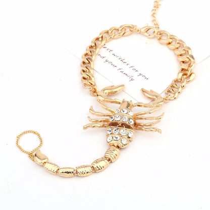 Faux diamond-studded scorpion anklet with silver chain and intricate details, stylish jewelry accessory for ankle adornment.