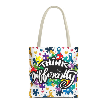 Colorful puzzle ribbon design on Think Differently Autism Awareness tote bag by Printify, showcasing vibrant artwork.