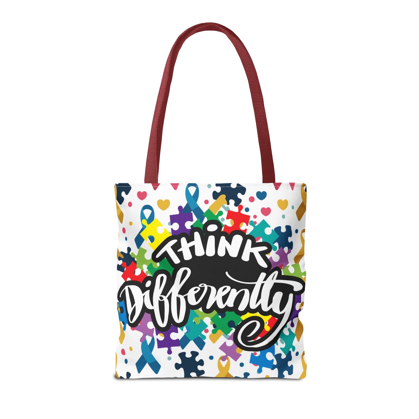 Colorful puzzle ribbon design on Think Differently autism awareness tote bag by Printify, showcasing vibrant patterns.