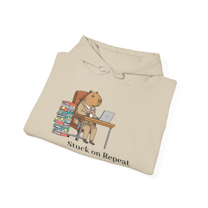 Capybara in a suit printed on a hoodie, featuring the "Stuck on Repeat" design by Printify on a comfortable hoodie.