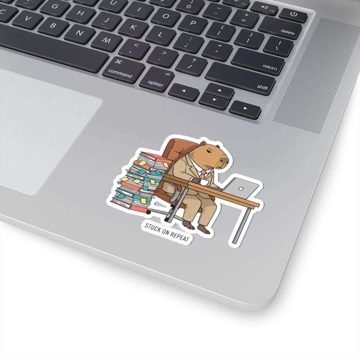 Stuck on Repeat Capybara office sticker featuring an unhinged animal illustration, perfect for decorating notebooks or laptops.