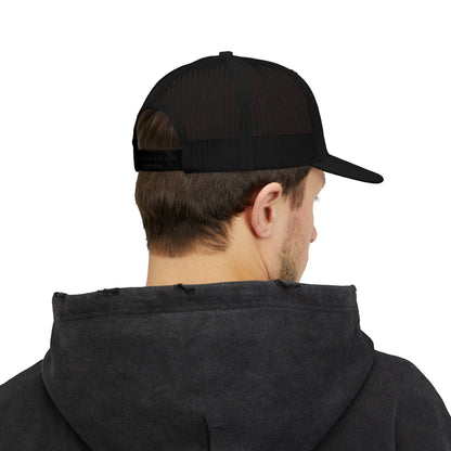 Printify Never Surrender snapback trucker hat with a curved bill and adjustable strap, featuring bold graphic design on front.