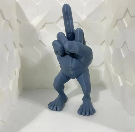 Zendrop middle finger hand figurine, detailed sculpture of a hand with an extended middle finger, black finish, collectible decor piece.