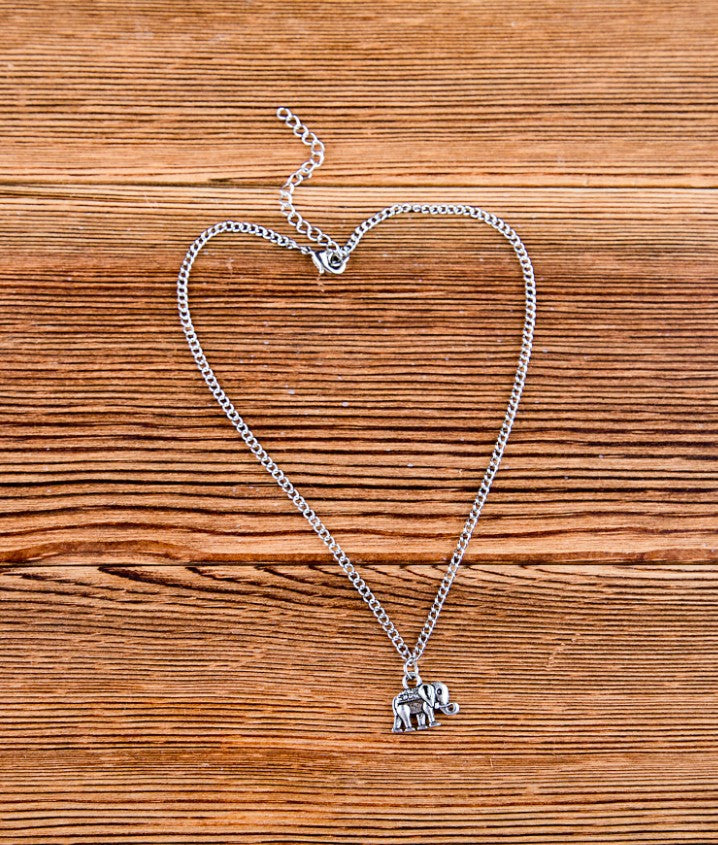 Vintage elephant anklet and bracelet set featuring intricate designs, crafted by Zendrop, perfect for boho and ethnic jewelry styles.