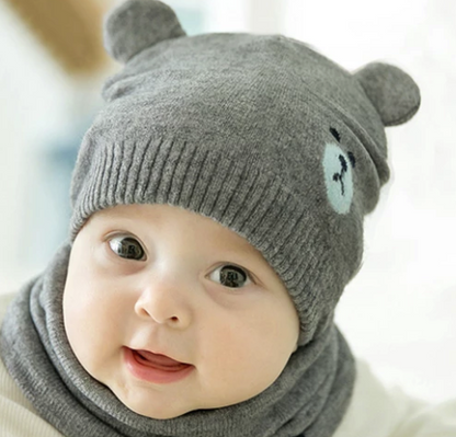 Ramshackle Shack hat and scarf set featuring a cozy knitted hat and matching scarf in warm, earthy tones.